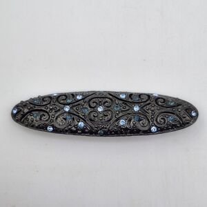Vintage 1928 Black Metal Bar Brooch With Blue Rhinestones
